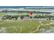 Stunning aerial view of charming townhomes adjacent to lush marshlands and winding waterways at 202 Mariners Cay Dr, Folly Beach, SC 29439