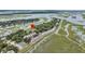 Unique aerial perspective of upscale townhomes with private tennis courts, surrounded by marsh views at 202 Mariners Cay Dr, Folly Beach, SC 29439