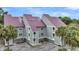 Townhome features red metal roof, spacious balconies, designated parking spaces and convenient access at 202 Mariners Cay Dr, Folly Beach, SC 29439