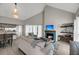 Inviting living room with vaulted ceilings, a cozy fireplace, and modern decor at 202 Mariners Cay Dr, Folly Beach, SC 29439
