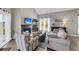 Comfortable living room with a charming fireplace, plush seating, and natural light at 202 Mariners Cay Dr, Folly Beach, SC 29439