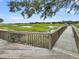 Scenic view from a wooden boardwalk overlooking a marsh with green reeds at 202 Mariners Cay Dr, Folly Beach, SC 29439