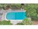 Aerial view of a sparkling community pool with lounge chairs and mature landscaping at 202 Mariners Cay Dr, Folly Beach, SC 29439