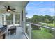 Comfortable furniture highlights this screened-in porch, with scenic views of a lagoon at 202 Mariners Cay Dr, Folly Beach, SC 29439