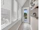 Bright porch with many windows and a door leading to outdoor space at 202 Mariners Cay Dr, Folly Beach, SC 29439