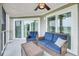 Comfortable furniture and outdoor ceiling fan makes for a great spot to unwind on this porch at 202 Mariners Cay Dr, Folly Beach, SC 29439