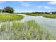 Picturesque view of river with lush grasses along the riverbank at 202 Mariners Cay Dr, Folly Beach, SC 29439