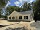 Inviting single-story home featuring a covered front porch with wooden support posts and dark shutters at 216 Hill Dr, Summerville, SC 29483