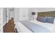 Comfortable bedroom featuring hardwood floors, a headboard, and ample storage at 217 Quimby Hill Dr, Huger, SC 29450