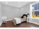Cozy bedroom featuring hardwood floors, a ceiling fan, and bright natural light at 217 Quimby Hill Dr, Huger, SC 29450