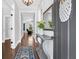 Welcoming entryway with hardwood floors and elegant decor at 217 Quimby Hill Dr, Huger, SC 29450