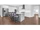 Modern kitchen with stainless steel appliances, a center island with bar seating, and white cabinetry at 217 Quimby Hill Dr, Huger, SC 29450