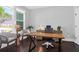 Bright home office with hardwood floors and plenty of natural light at 217 Quimby Hill Dr, Huger, SC 29450