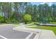 Well-maintained community playground with green play structures and a cushioned, safe play surface at 217 Quimby Hill Dr, Huger, SC 29450