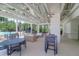 A poolside lounge area is furnished with comfortable seating and tables, perfect for relaxing near the pool at 217 Quimby Hill Dr, Huger, SC 29450
