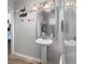 Chic bathroom featuring a pedestal sink, modern lighting, and a glass-enclosed shower at 2170 Midland Park Rd, North Charleston, SC 29406