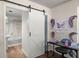 Bathroom with a sliding barn door, sink, and shower-tub combo at 2170 Midland Park Rd, North Charleston, SC 29406