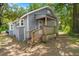 Charming home exterior with a covered porch, wooden railings, and brick foundation at 2170 Midland Park Rd, North Charleston, SC 29406