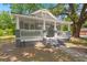 Inviting front porch featuring classic white railing and painted brick pillars at 2170 Midland Park Rd, North Charleston, SC 29406