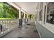 Spacious front porch with patterned tile flooring and white railing at 2170 Midland Park Rd, North Charleston, SC 29406