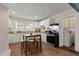 Bright kitchen with white cabinets, natural light, and wood-look flooring at 2170 Midland Park Rd, North Charleston, SC 29406