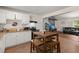 Open kitchen with a dining table, seamlessly connecting to a cozy living area at 2170 Midland Park Rd, North Charleston, SC 29406