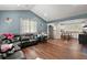 Open-concept living area with modern appliances, a gray wall, wood floors and a table at 2170 Midland Park Rd, North Charleston, SC 29406