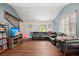 Spacious living room with wood floors, gray walls, and plenty of seating at 2170 Midland Park Rd, North Charleston, SC 29406