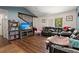 Bright living room featuring wood floors, gray accent wall and decor at 2170 Midland Park Rd, North Charleston, SC 29406
