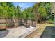 Private backyard featuring a patio, seating and mature trees at 2404 Fulford Ct, Mount Pleasant, SC 29466