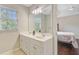 This bathroom has a double vanity with storage, a large mirror, and natural light from the window at 2404 Fulford Ct, Mount Pleasant, SC 29466
