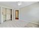 A spacious bedroom features built in shelving, neutral carpet and paint, and an ensuite door at 2404 Fulford Ct, Mount Pleasant, SC 29466
