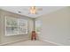 Bright bedroom with large windows for natural light, complemented by soft carpeting and a cozy rocking chair at 2404 Fulford Ct, Mount Pleasant, SC 29466