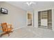Comfortable bedroom featuring plush carpeting, a ceiling fan, mounted tv, and closet with built in shelving at 2404 Fulford Ct, Mount Pleasant, SC 29466