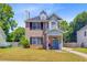 Charming two-story brick home with a landscaped yard, covered entry, and inviting curb appeal at 2404 Fulford Ct, Mount Pleasant, SC 29466