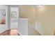 Bright upstairs hallway with wood floors and a view into a carpeted bedroom at 2404 Fulford Ct, Mount Pleasant, SC 29466