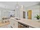 Bright, open kitchen with modern stainless steel appliances, white cabinets and a large island with a sink at 2404 Fulford Ct, Mount Pleasant, SC 29466