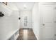 Bright entryway with a built-in bench, coat hooks, and a view to the outdoor seating area at 286 Godwit Dr, Summerville, SC 29486