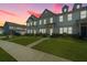 Charming townhome featuring a manicured lawn, beautiful architectural details, and a welcoming curb appeal at 286 Godwit Dr, Summerville, SC 29486