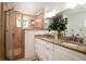 Bathroom with glass shower, granite countertops and double sink vanity with great lighting at 31 Lyttleton Ave, Charleston, SC 29407