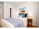 Cozy bedroom with natural light, comfortable bed with stylish linens and closet with storage at 31 Lyttleton Ave, Charleston, SC 29407