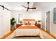 Bright bedroom with wood floors and ceiling fan offers ample closet space and natural light at 31 Lyttleton Ave, Charleston, SC 29407