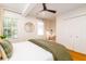 Inviting bedroom features wood floors, ceiling fan, closet, and warm, earthy tones at 31 Lyttleton Ave, Charleston, SC 29407
