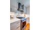 Modern kitchen with gas stove, tile backsplash, and granite countertops and white cabinets at 31 Lyttleton Ave, Charleston, SC 29407