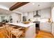Modern kitchen with island, stainless steel appliances, stylish chairs, and lots of counter space at 31 Lyttleton Ave, Charleston, SC 29407