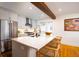 Bright kitchen with granite island, stainless steel appliances, open floor plan and hardwood floors at 31 Lyttleton Ave, Charleston, SC 29407