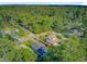 An aerial view shows houses surrounded by a canopy of mature trees in the neighborhood at 316 Simmons Ave, Summerville, SC 29483