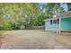 Spacious backyard with mature trees, shed, privacy fence and ample room for outdoor activities at 316 Simmons Ave, Summerville, SC 29483