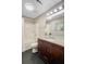 Bathroom features granite countertop, wooden vanity, and shower-tub combination at 316 Simmons Ave, Summerville, SC 29483
