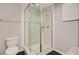 Bathroom with a glass-enclosed shower, toilet, and neutral color scheme at 316 Simmons Ave, Summerville, SC 29483